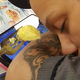 Drunk man taunts a sleeping Waffle House employee. Photo: Stewart Dyches/Facebook